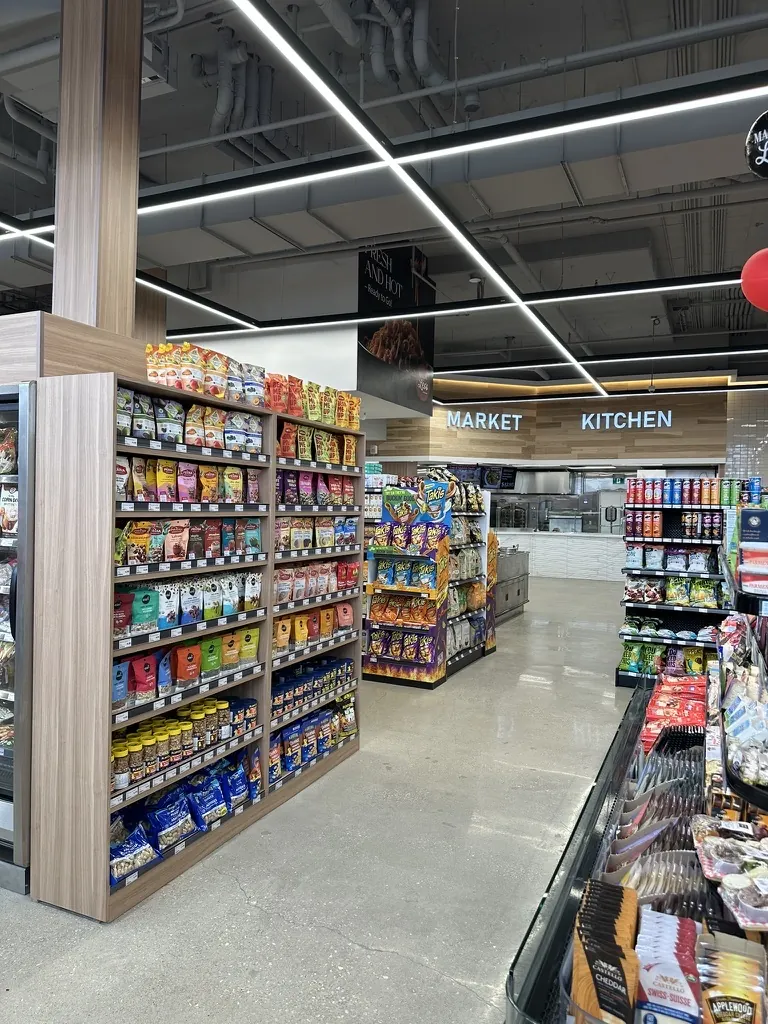 Custom market kitchen retail shelving by Newood Millwork